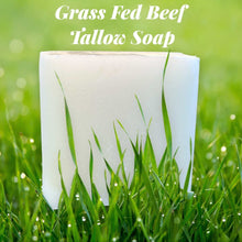 Load image into Gallery viewer, Grass fed tallow soap bar on green grass for moisturizing skin care