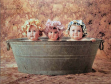 Load image into Gallery viewer, three babies in vintage metal tub wearing floral bonnets vintage bath scene