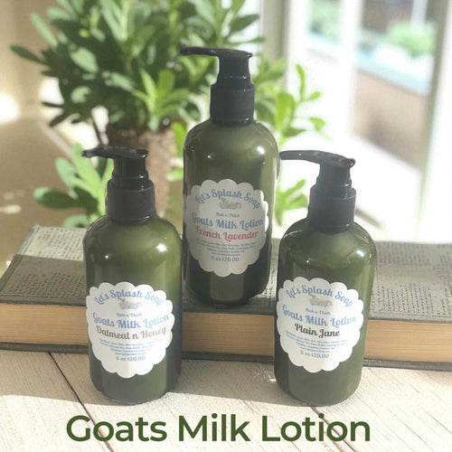 Luxurious Goats Milk Lotion in green pump bottles with oatmeal honey, French lavender, and plain Jane scents on wooden surface